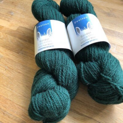 Kilburn DK yarn is a deep forest green DK yarn with fabulous lustre and jewel-like colour