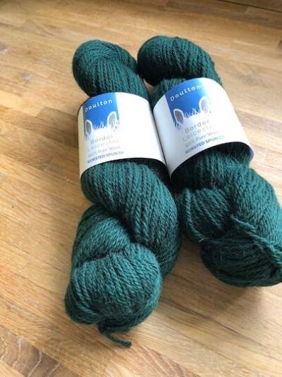 Kilburn DK yarn is a deep forest green DK yarn with fabulous lustre and jewel-like colour