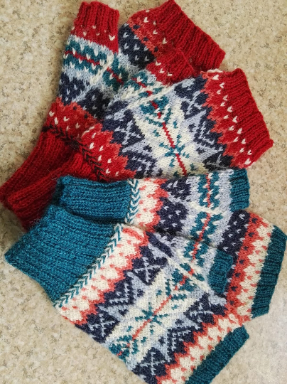 Splash of Colour Mitts Knitting Kit contains pattern and yarn to knit 2 pairs of fair isle mitts in different colourways. 100% British wool.