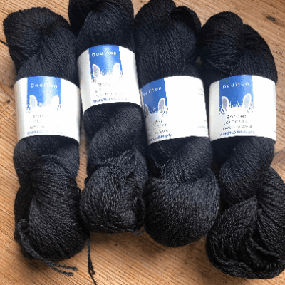 skeins of DK yarn in black whitby jet
