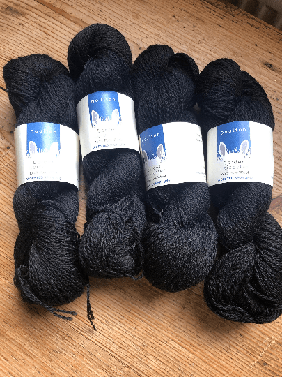 skeins of DK yarn in black whitby jet