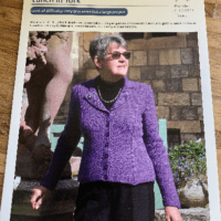 Woman wearing woolen jacket knitting kit made from border leicester yarn