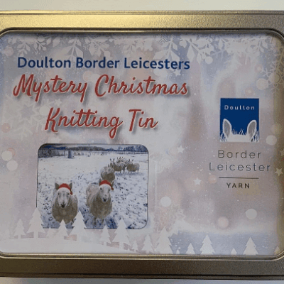 Mystery Christmas Knitting Tin gift with pattern and yarn to create a unique accessory plus other goodies