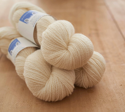 Sheep 4ply yarn, undyed and natural shade in our range of Yorkshire-inspired colours. Provides a clean background.
