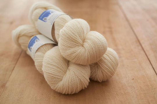 Sheep 4ply yarn, undyed and natural shade in our range of Yorkshire-inspired colours. Provides a clean background.