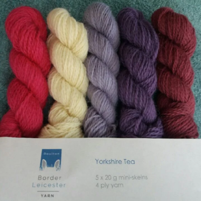 Yorkshire Tea pack of 5 mini skeins of 4ply yarn in purples, pinks and ivory. Inspired by a Yorkshire cream tea of jam, scones and cream