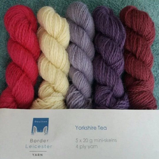 Yorkshire Tea pack of 5 mini skeins of 4ply yarn in purples, pinks and ivory. Inspired by a Yorkshire cream tea of jam, scones and cream