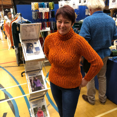 Woman wearing Roll Neck, Ribbed Sweater Knitting Kit made from Border Leicester Yarn