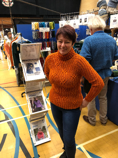 Woman wearing Roll Neck, Ribbed Sweater Knitting Kit made from Border Leicester Yarn