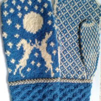 Doulton Hares Mittens, cable and stranded knitting with Latvia braid trim. In two colours of rare breed, slaughter-free yarn.