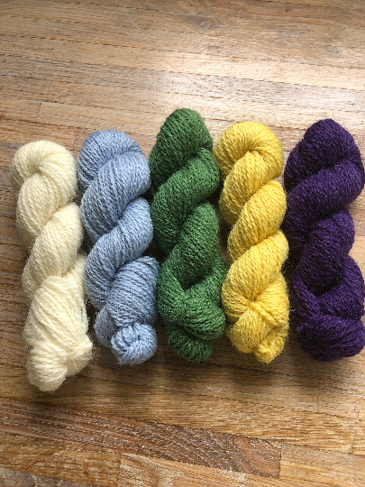Yorkshire Spring pack of 4ply mini skeins, 20g each, in a pack 5 shades of ivory, pale blue, grass green, yellow and purple