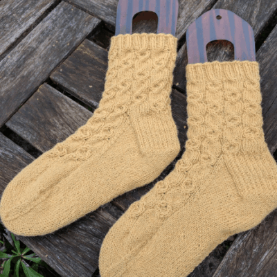 knitted socks in clay bank yellow