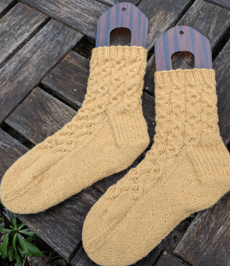 knitted socks in clay bank yellow
