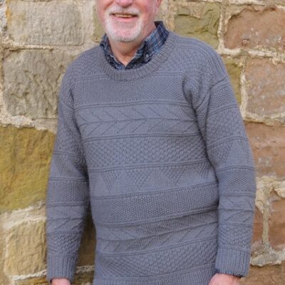 Man wearing woolen sweater knitting kit made from border leicester yarn