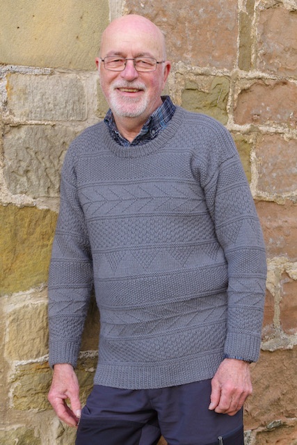 Man wearing woolen sweater knitting kit made from border leicester yarn