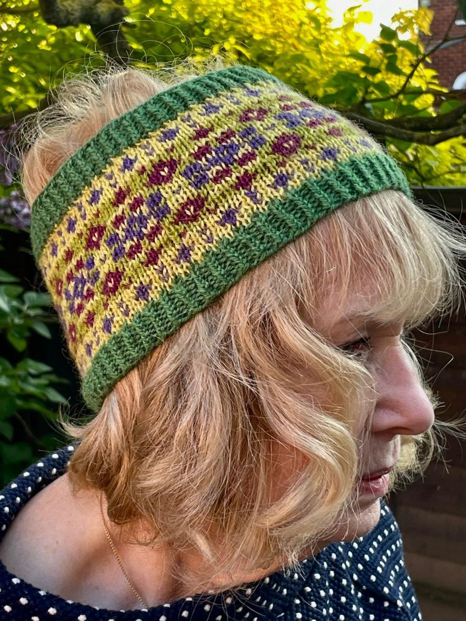 Woman wearing woolen headband knitting kit made from border leicester yarn