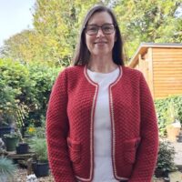 Woman wearing woolen jacket knitting kit made from border leicester yarn