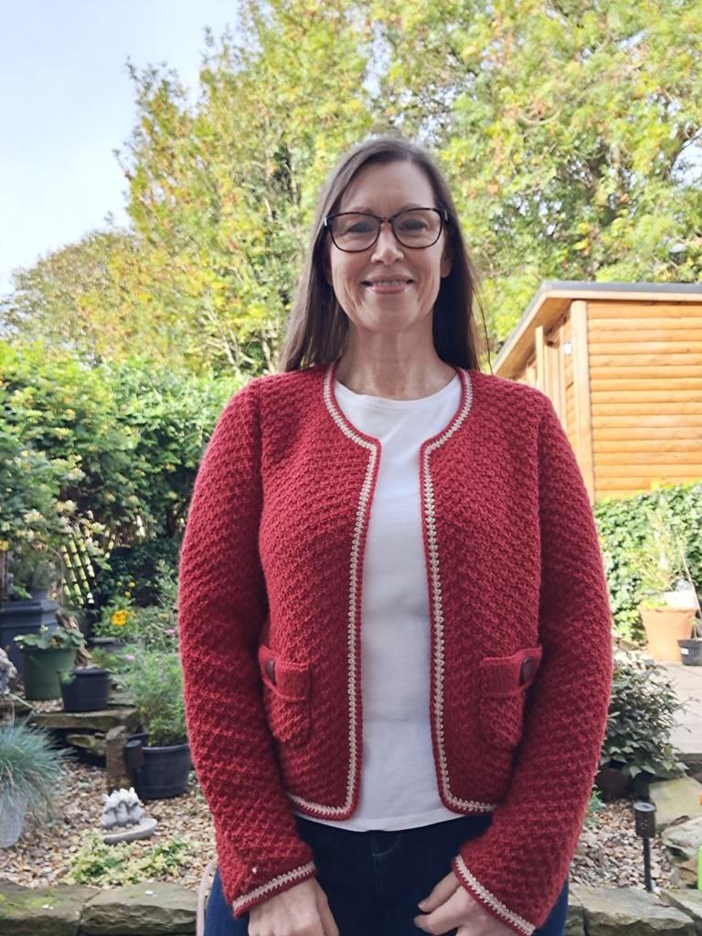 Woman wearing woolen jacket knitting kit made from border leicester yarn