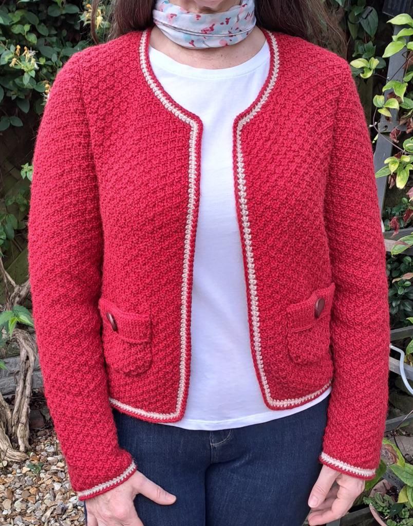 Woman wearing woolen jacket knitting kit made from border leicester yarn