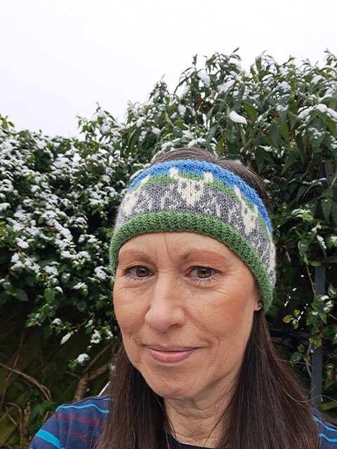 Woman wearing woolen headband knitting kit made from border leicester yarn