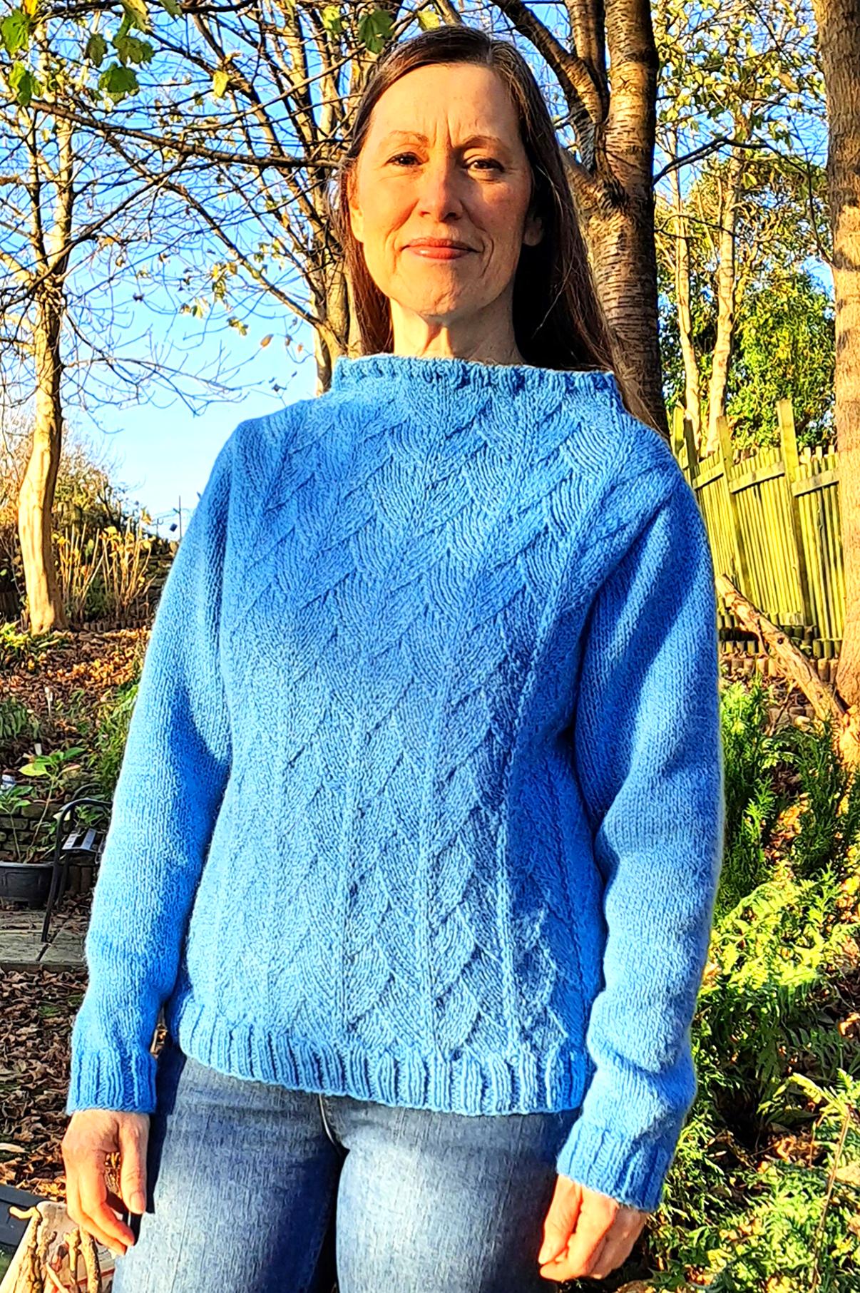 Woman wearing Loschy Hill knitted sweater knitting kit made from border leicester aran yarn