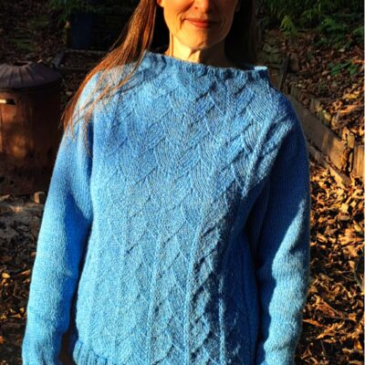 Woman wearing woolen sweater knitting kit made from border leicester yarn